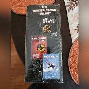 Scholastic The Hunger Games Trilogy Board Game - Red, Orange, Blue